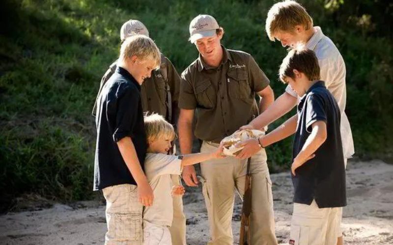 Children enjoying a guided safari in the Kruger National Park, showing why the Kruger National Park is safe for kids on a family safari.
